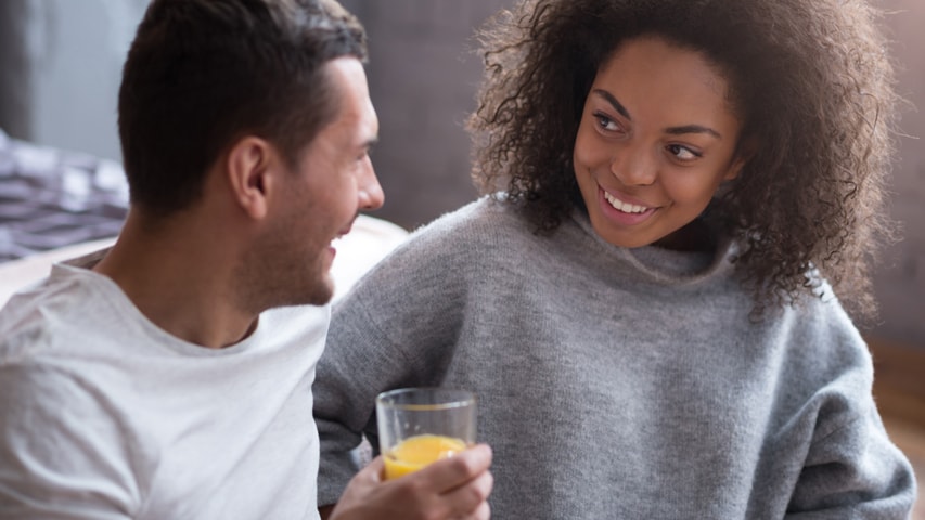 A man and woman smiling at each other