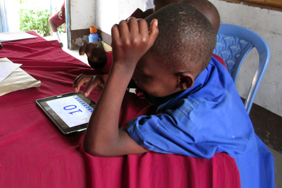 Image of a student working on a tablet