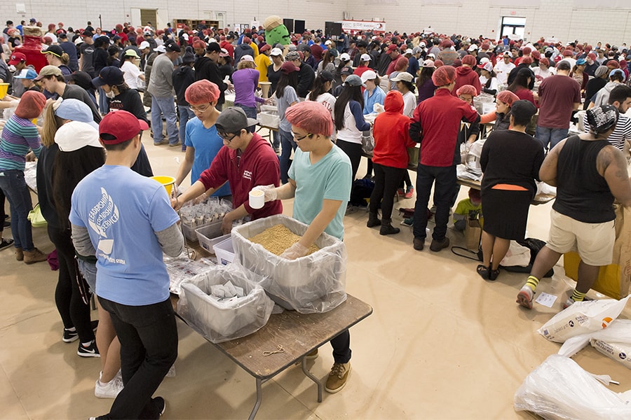 Image of volunteers packaging food in 2016