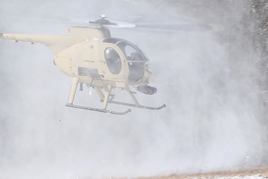 An image of a helicopter obscured by snow