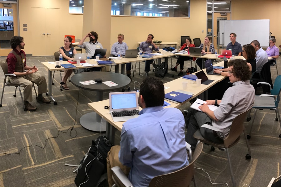 Image of researchers sitting around a table