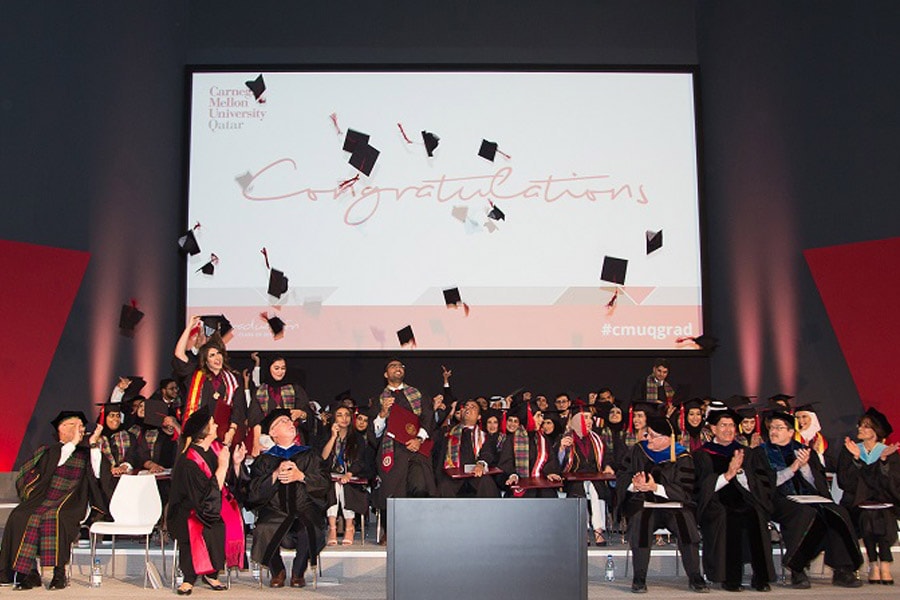 Image of mortar boards being tossed