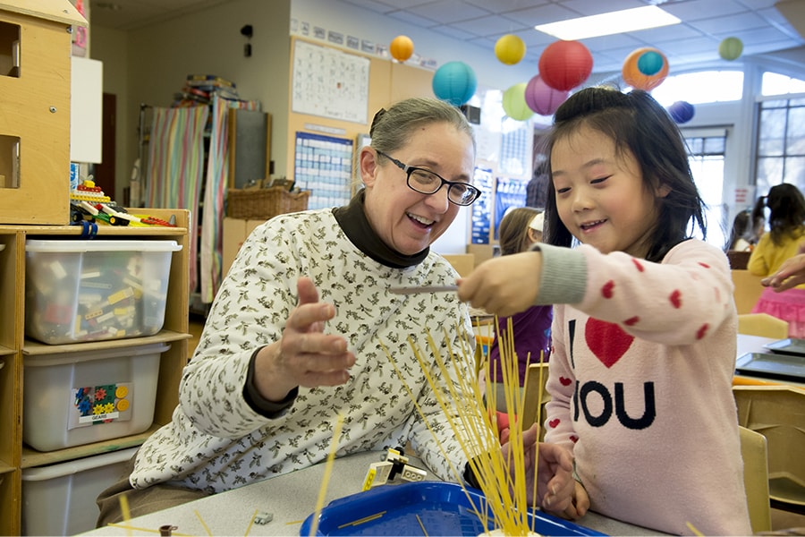 Image of Chidren's School Director Sharon Carver and a child