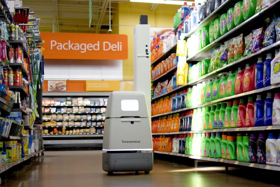 Image of a Bossa Nova robot navigating a Wal-Mart aisle