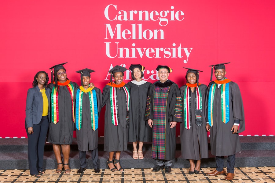 Image of Farnam Jahanian, Reeta Roy and Crystal Rugege with students