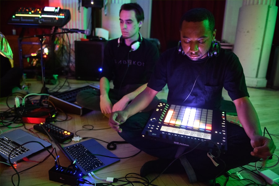 Image of two men at a sound station