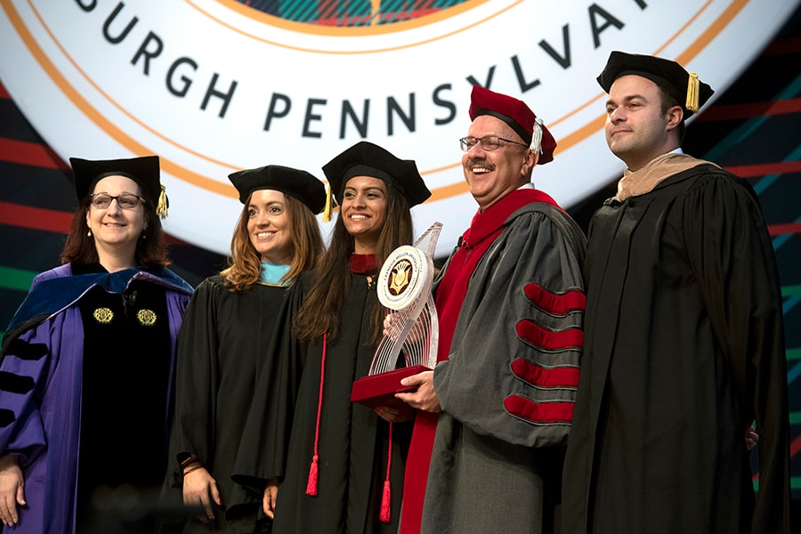 Jahanian receives thistle sculpture during Investiture Ceremony