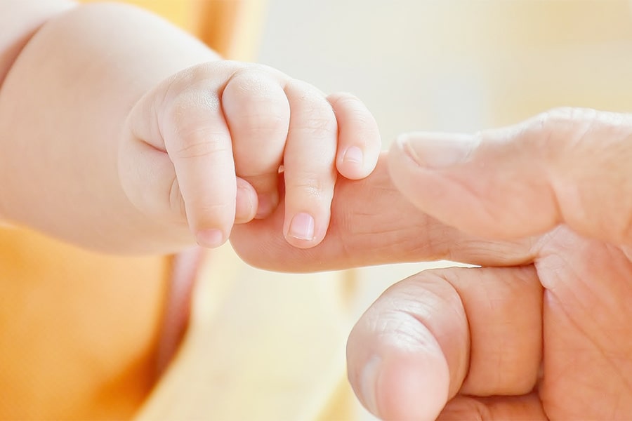 Image of mother's and baby's hands