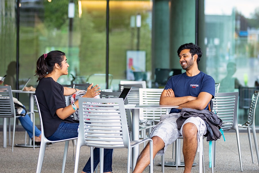 photo of students chatting outside Tepper Quad