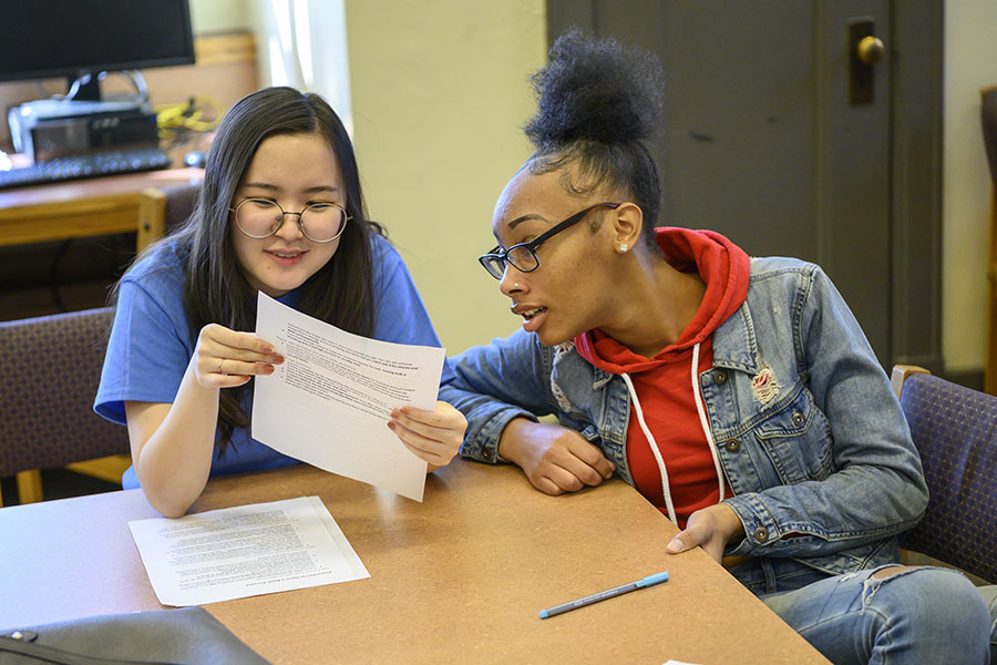 Photo of a Moneythink volunteer teaching.