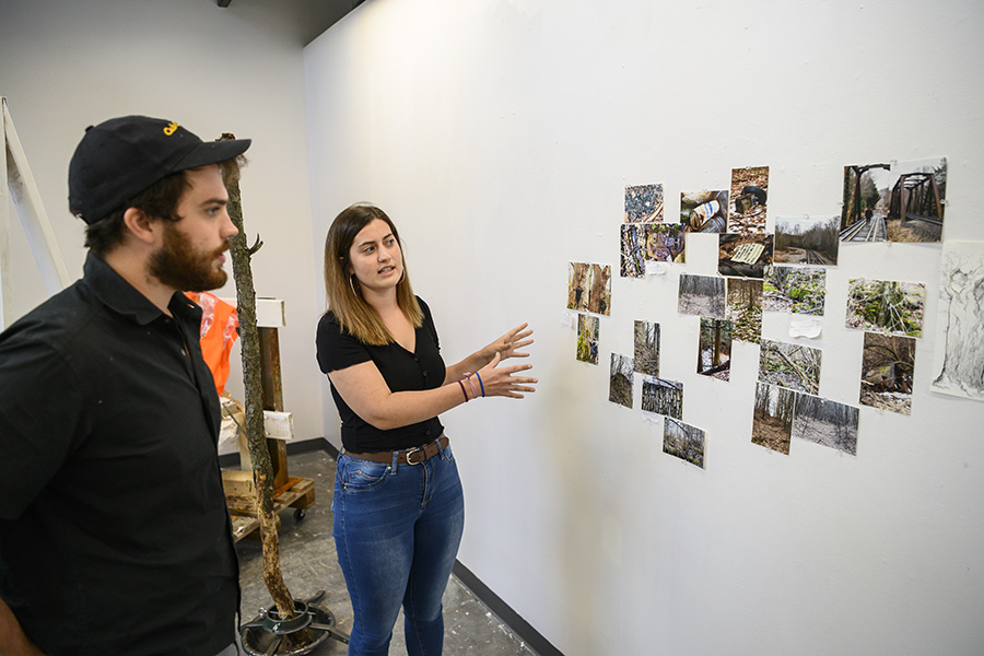 A photo of the Horgans looking over their process work.