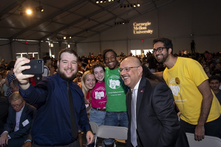 A photo of Farnam Jahanian posing with head orientation counselors