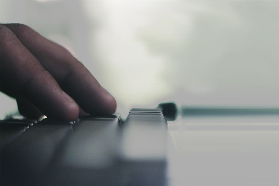 Image of hand at typewriter