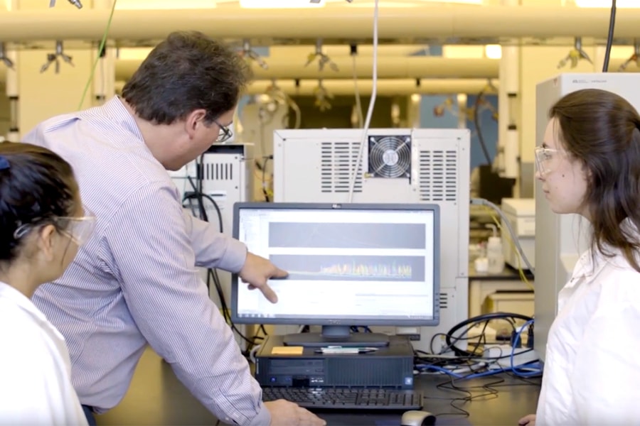 Scientists at a computer.