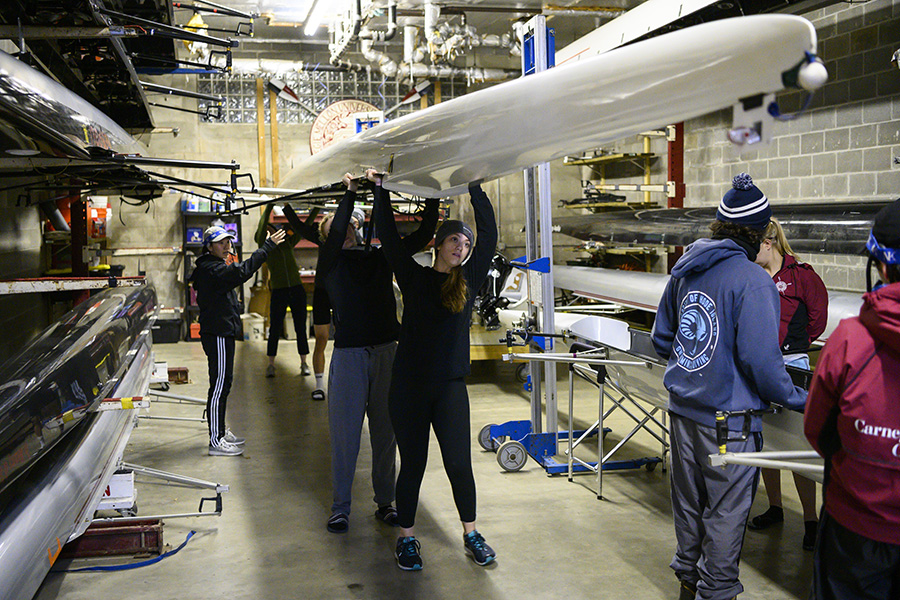 Students carrying a boat