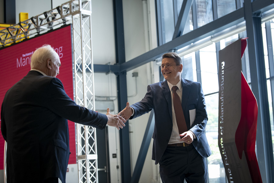 A photo of Gary Fedder shaking hands with Representative Mike Kelly.