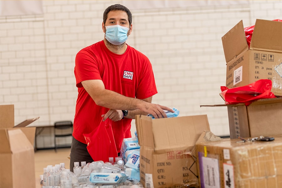 Image of Aaron Riddle packing boxes