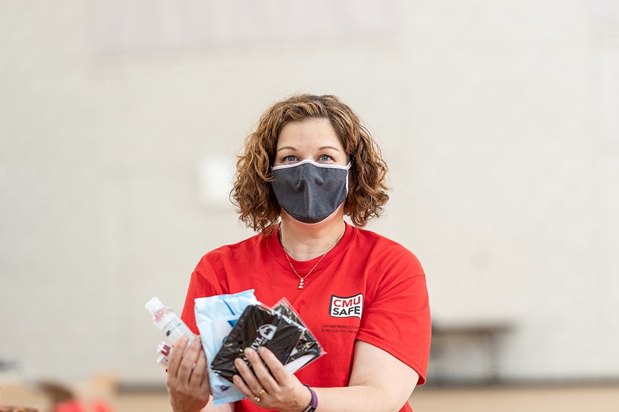 image of Jennifer Bett holding kit items