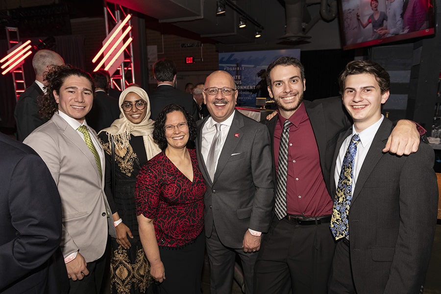 Al Ali poses in a group photo with CMU President Farnam Jahanian