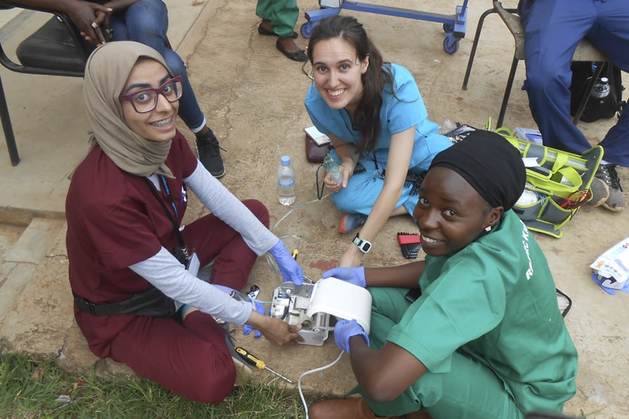 Al Ali helps to fix a nebulizer