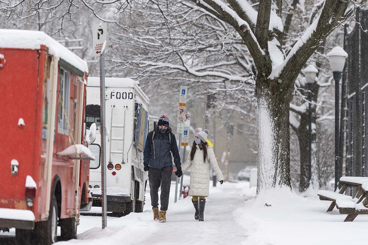 Students walking past campus