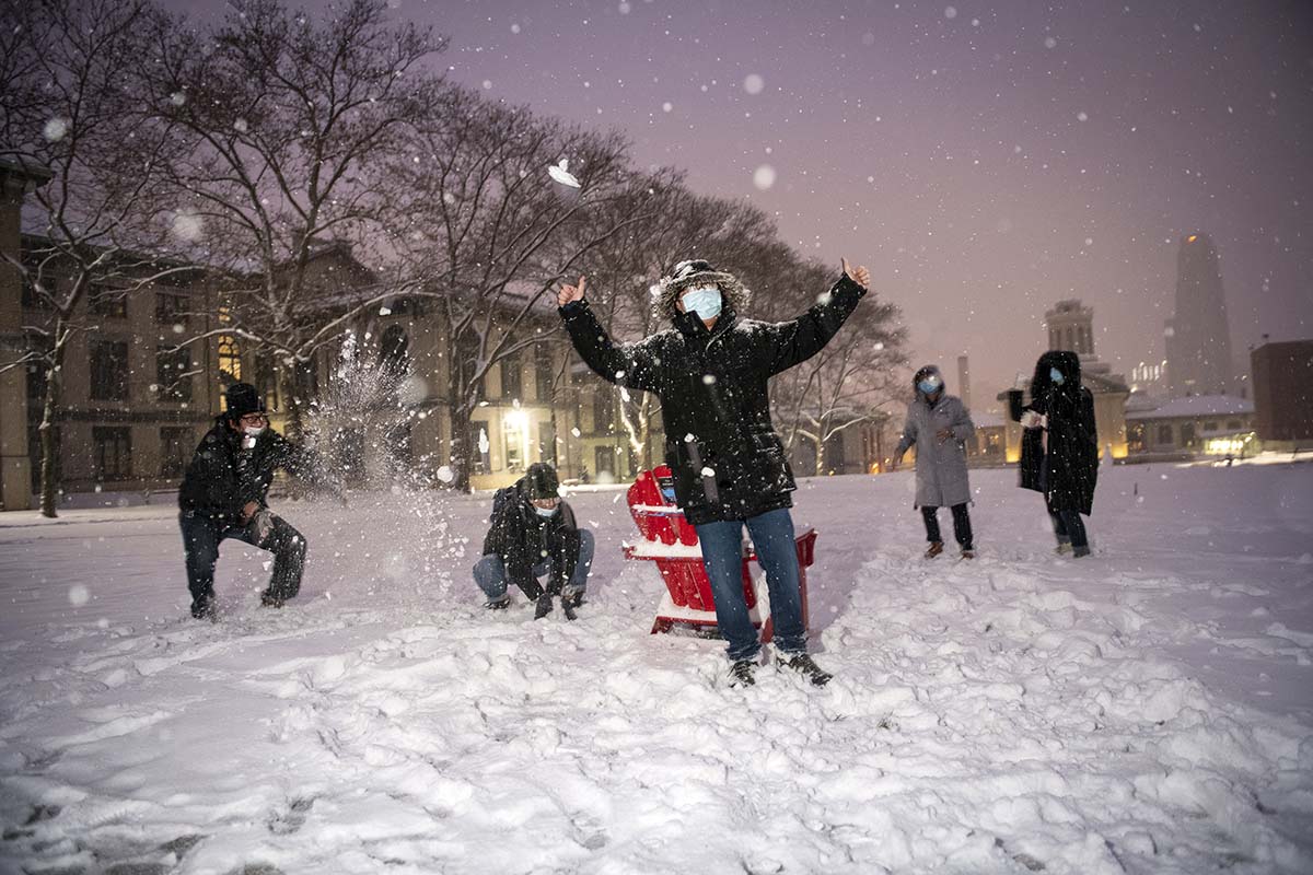 A snowball fight on campus