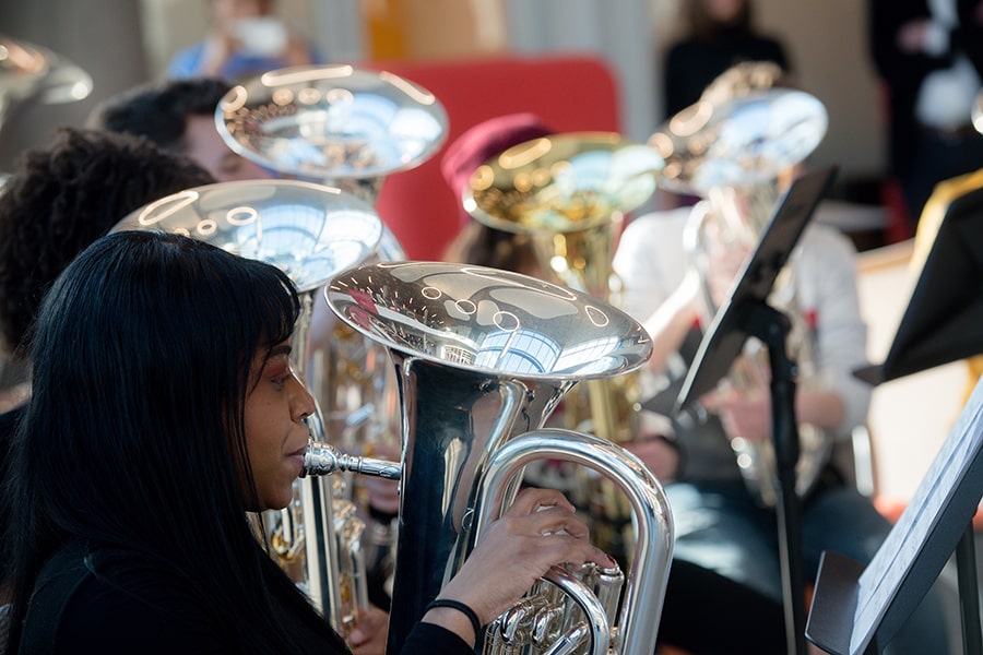 image of various tubas and tuba players