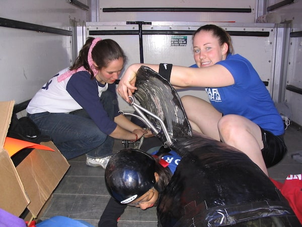 a group of women builds a Buggy