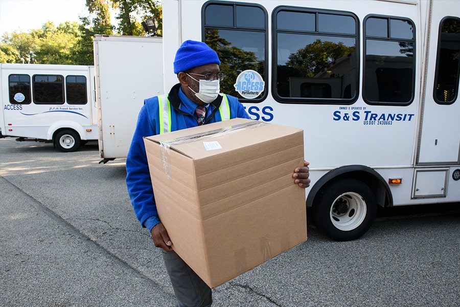 Worker carries box