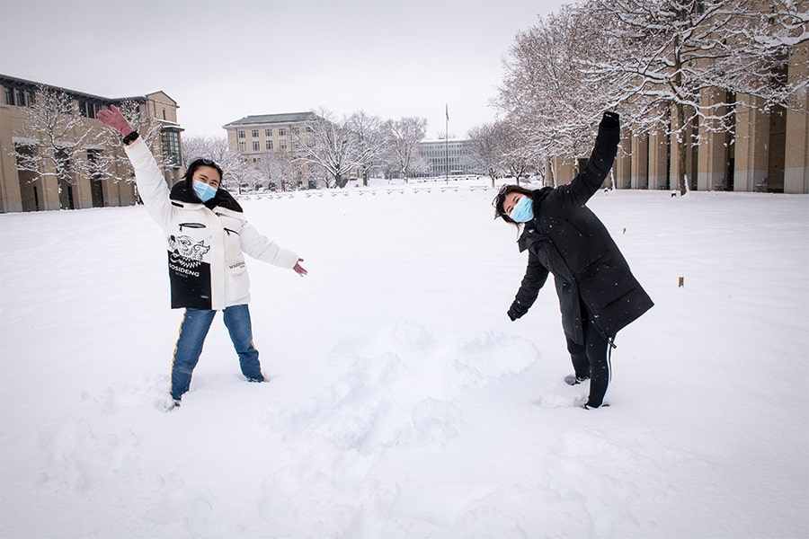 Students in the snow on campus