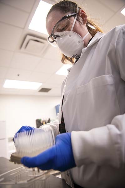 A photo of a lab worker