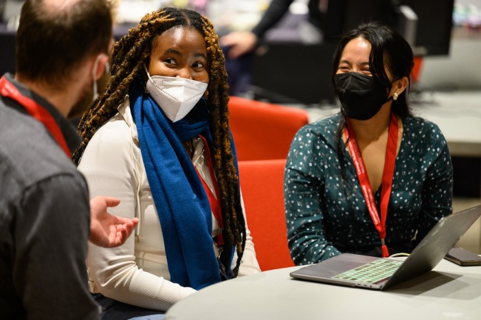 A picture of brainplay conference attendees engaged in conversation. 