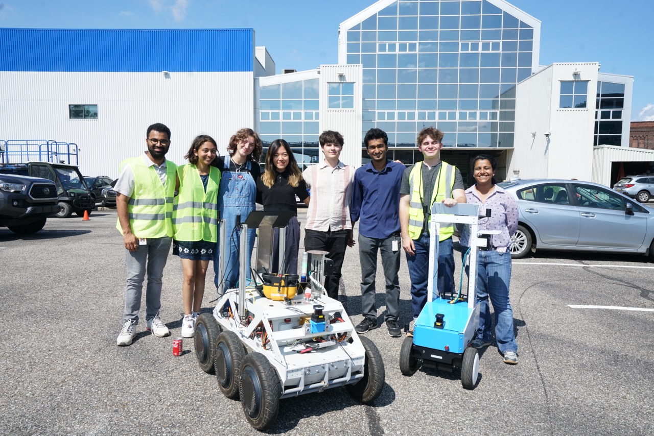 interns pose with internal development projects