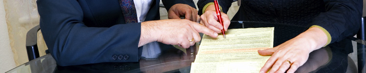 Two business people reviewing a document together