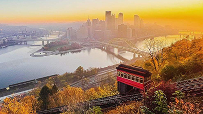 View of downtown Pittsburgh and the incline in the fall with colorful leaves