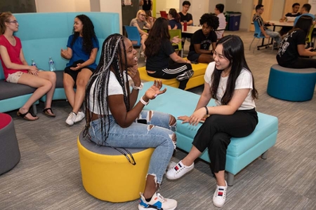 students having a conversation in The Center