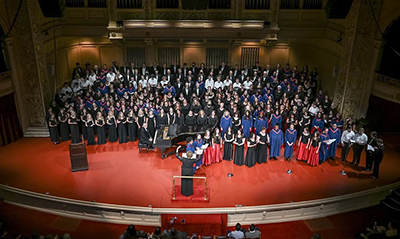 Image of choirs on stage singing