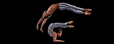 Image of two acrobats, one doing a backwards flip over a person contorted