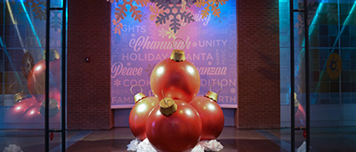Large holiday ornaments stacked on top of each other