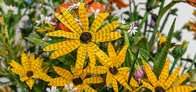 Image of yellow daisies made out of book pages