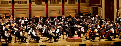 Image of the symphony playing in a concert hall