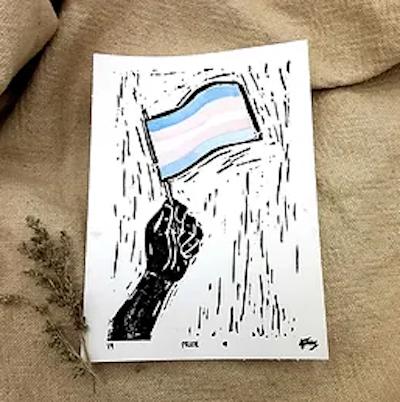 Image of a linocut of a hand holding a trans flag