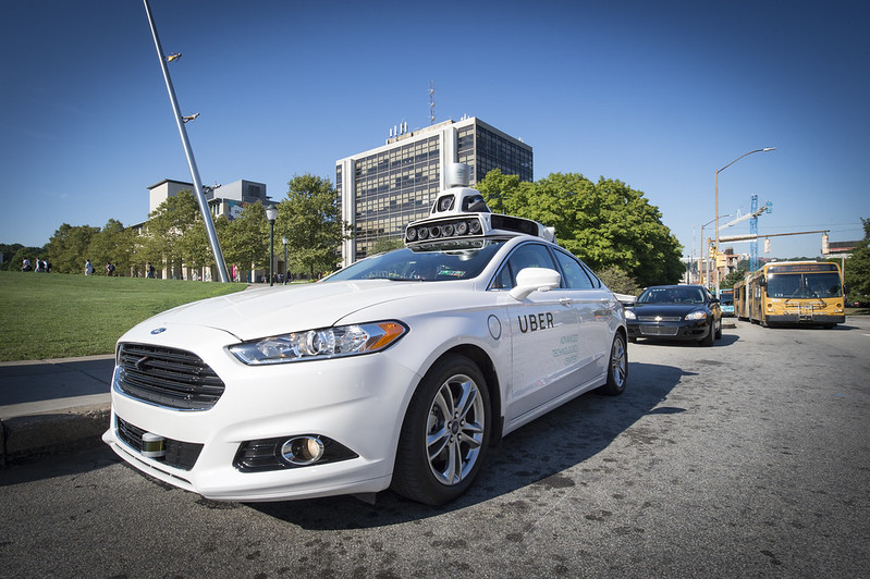 Image of a self-driving car parked at the curb