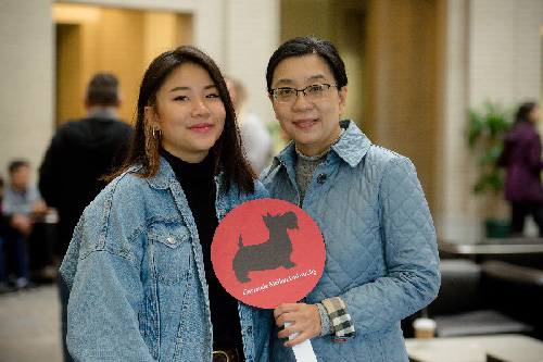 CMU student smiling with parent during Family Weekend