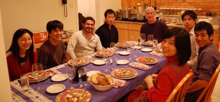 CMU Students eating dinner with host family