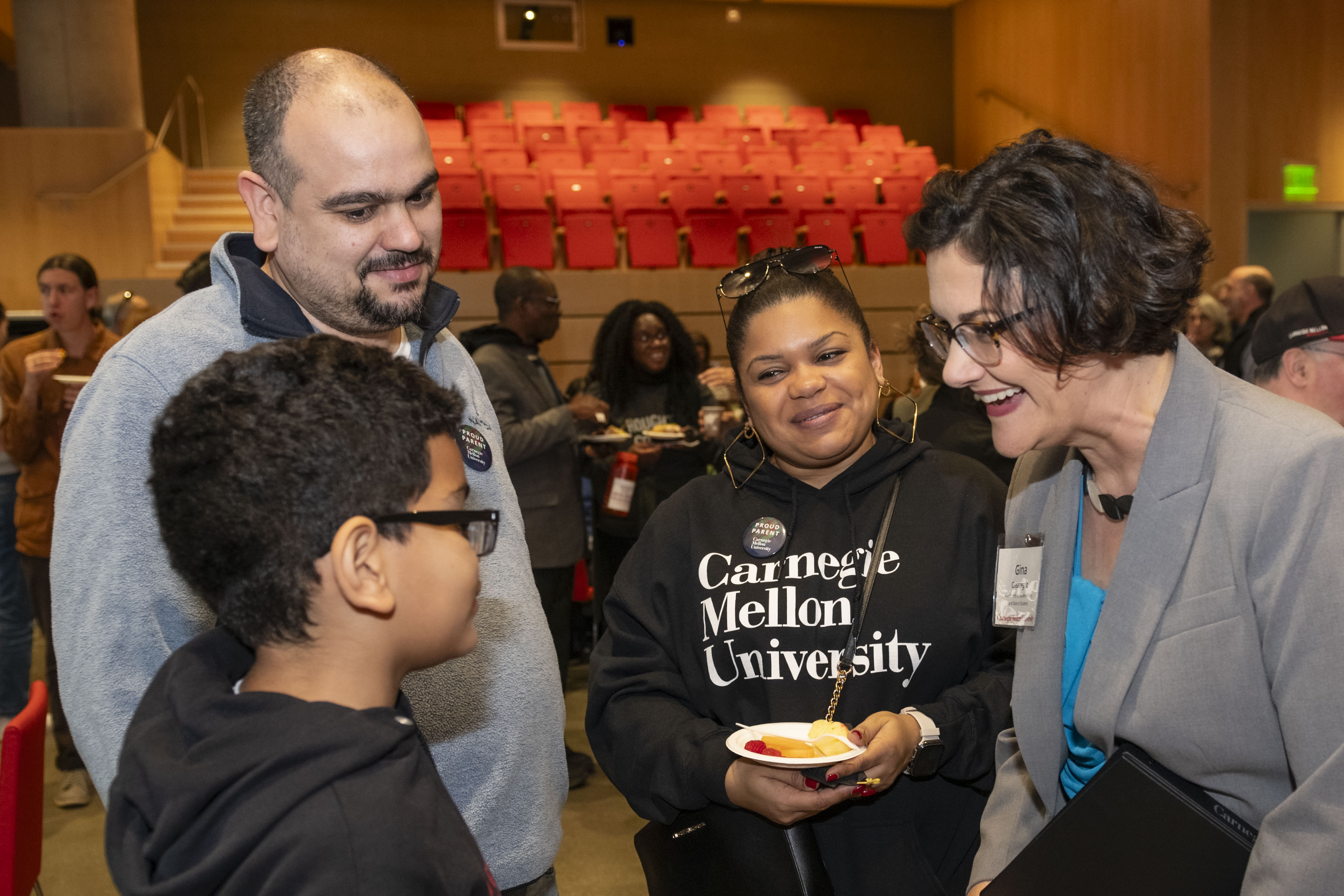 Vice President for Student Affairs and Dean of Students Gina Casalegno speaking with family members at the President's Welcome.