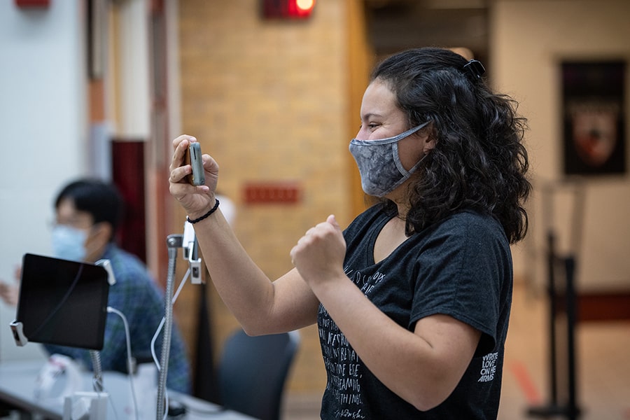 a student FaceTiming on her cell phone