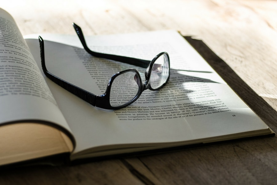 Photo of glasses on top of an open book