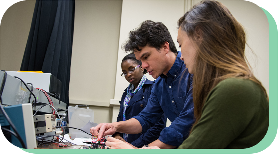 Ben Hunt in Physics Lab with Students