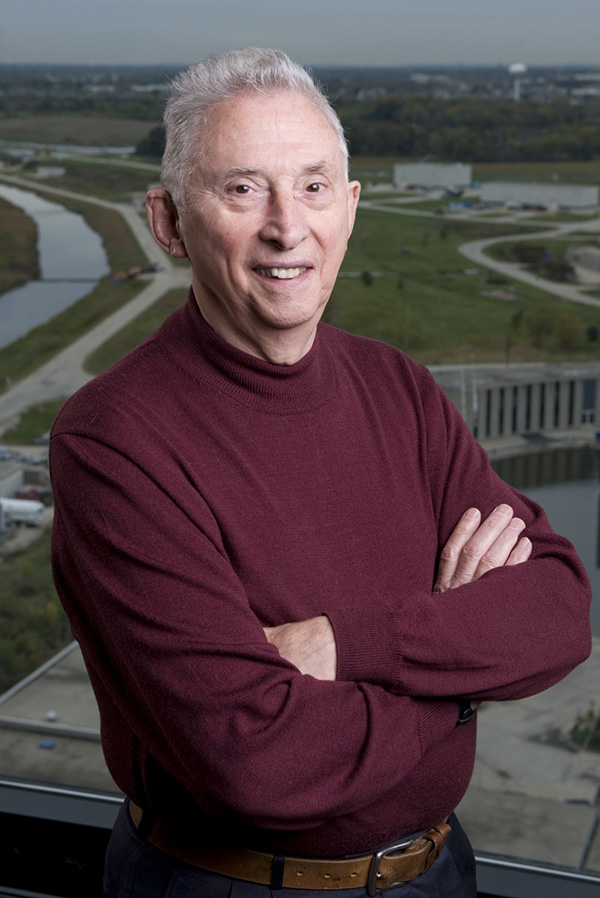 Image of a man standing with his arms crossed